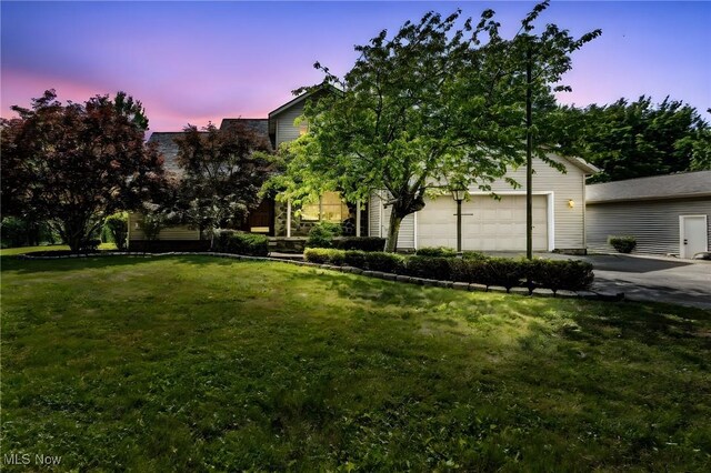 3578 County Line Rd, Madison, OH 44057 - obstructed view of property with driveway and a lawn