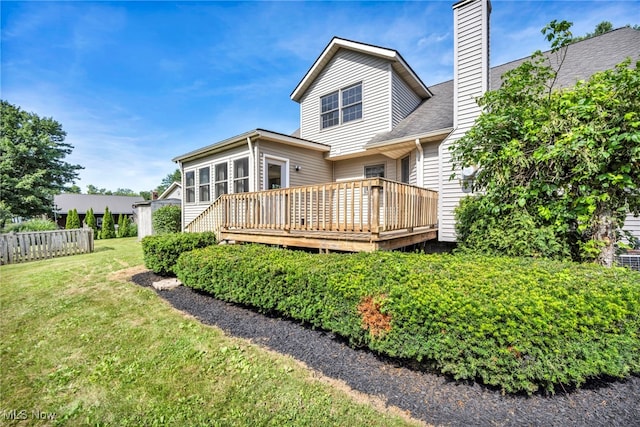 3578 County Line Rd, Madison, OH 44057 - back of property featuring a chimney and a wooden deck