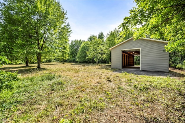 3578 County Line Rd, Madison, OH 44057 - view of yard featuring an outbuilding and a detached garage