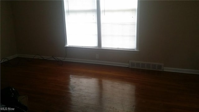 19030 Lake Shore Blvd, Euclid, OH 44119 - empty room with wood finished floors and baseboards