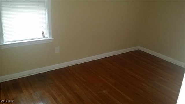 19030 Lake Shore Blvd, Euclid, OH 44119 - spare room featuring wood finished floors and baseboards