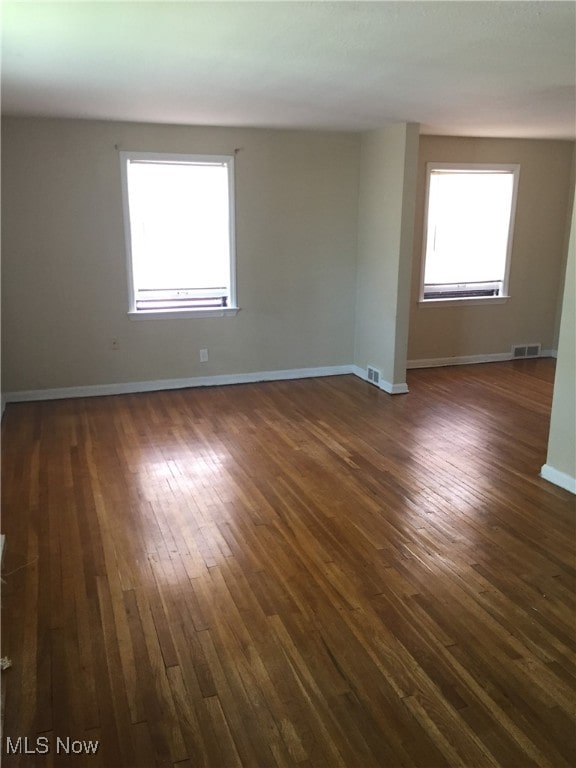 19030 Lake Shore Blvd, Euclid, OH 44119 - empty room with dark wood finished floors and plenty of natural light