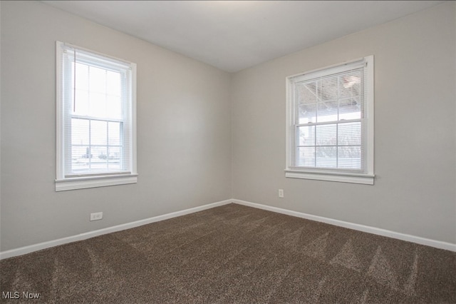4607 Lincoln Ave, Parma, OH 44134 - spare room featuring healthy amount of natural light and dark colored carpet