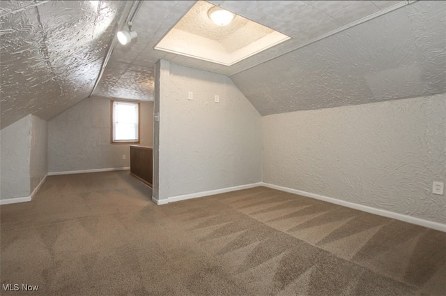 4607 Lincoln Ave, Parma, OH 44134 - bonus room featuring carpet floors, lofted ceiling, a textured wall, and a textured ceiling