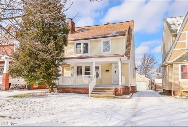 1016 Quilliams Rd, Cleveland Heights, OH 44121 - traditional style home featuring covered porch, a chimney, an outdoor structure, and a detached garage