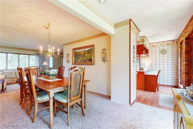 6803 County Road 22a, Bloomingdale, OH 43910 - dining area featuring a chandelier, light colored carpet, and ornamental molding