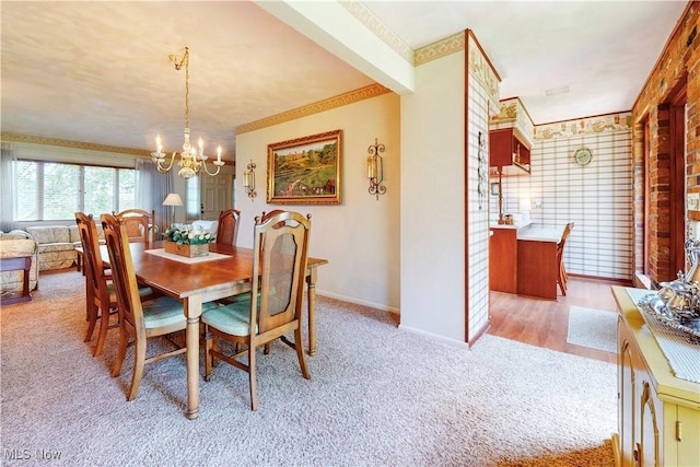 6803 County Road 22a, Bloomingdale, OH 43910 - dining area with light carpet, a chandelier, and ornamental molding