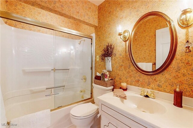 6803 County Road 22a, Bloomingdale, OH 43910 - bathroom with wallpapered walls, vanity, and bath / shower combo with glass door