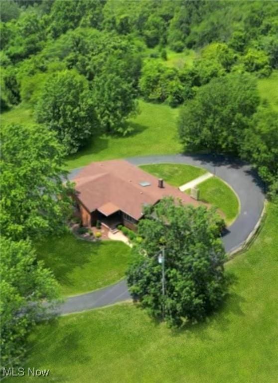 6803 County Road 22a, Bloomingdale, OH 43910 - aerial view of property and surrounding area featuring a heavily wooded area