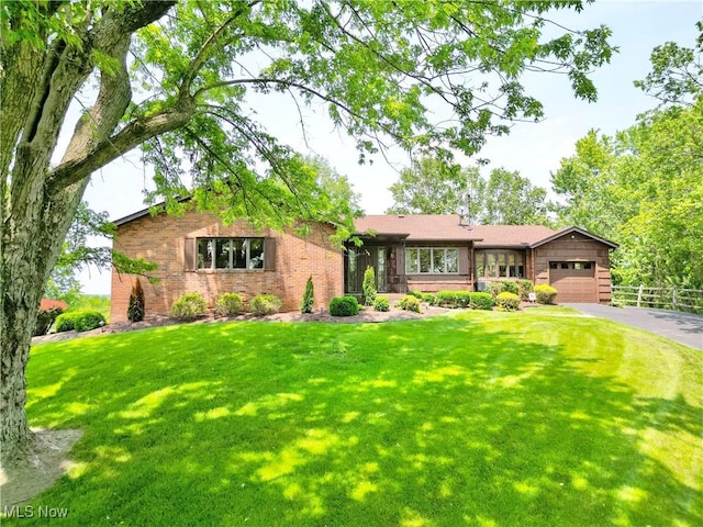6803 County Road 22a, Bloomingdale, OH 43910 - view of front of property with driveway, a garage, and brick siding