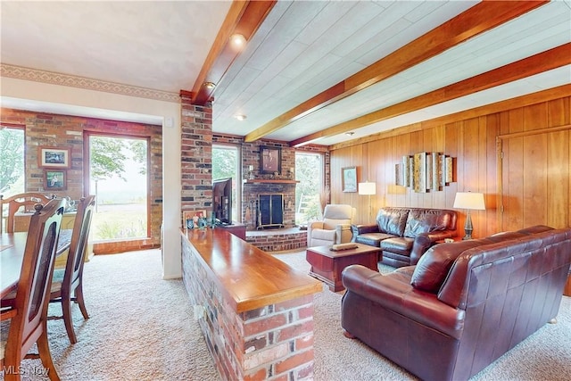 6803 County Road 22a, Bloomingdale, OH 43910 - living area featuring carpet, a fireplace, beamed ceiling, and wood walls