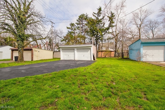 3509 Silsby Rd, University Heights, OH 44118 - view of yard with an outbuilding and a detached garage