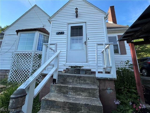 73 High St, Clay, WV 25043 - doorway to property with a chimney