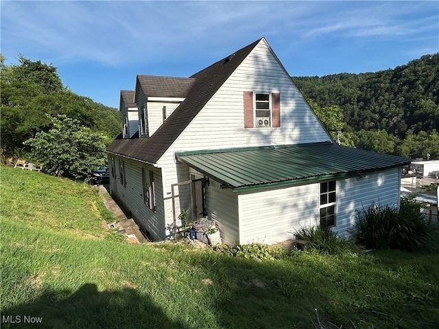 73 High St, Clay, WV 25043 - view of side of property with a yard and a view of trees