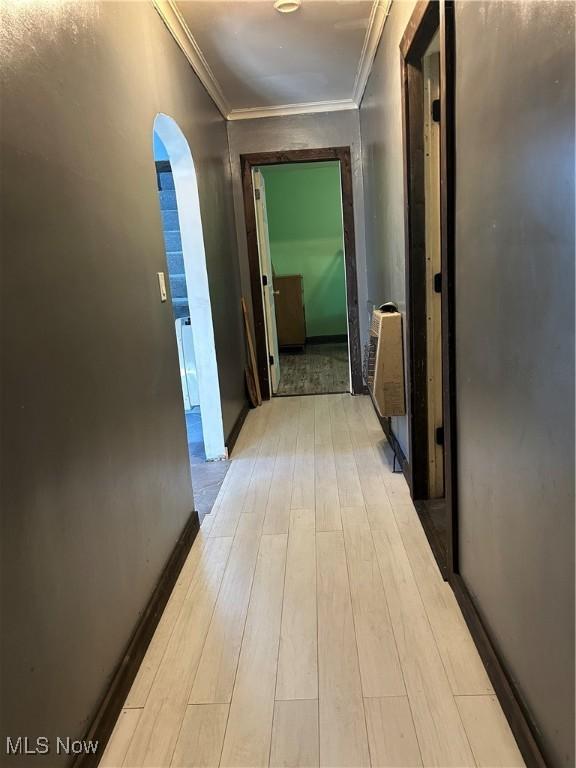 73 High St, Clay, WV 25043 - hallway with heating unit, wood finished floors, arched walkways, and crown molding