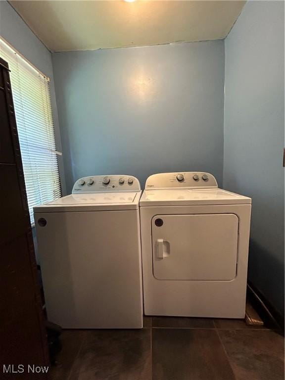 73 High St, Clay, WV 25043 - washroom featuring washer and dryer and dark tile patterned floors