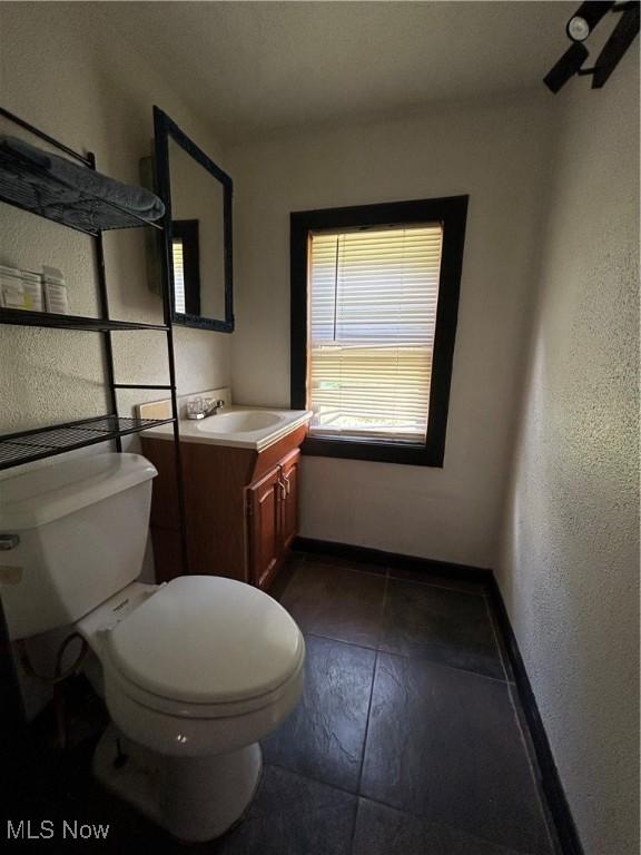 73 High St, Clay, WV 25043 - bathroom with vanity and a textured wall