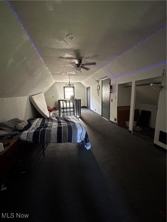 73 High St, Clay, WV 25043 - carpeted bedroom with lofted ceiling, multiple closets, and a ceiling fan