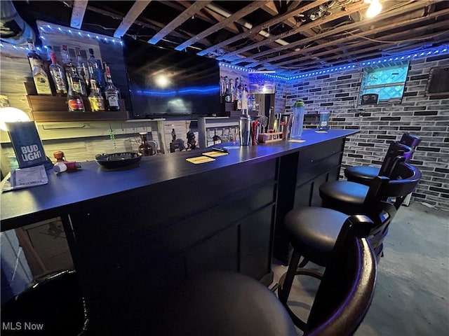 73 High St, Clay, WV 25043 - indoor bar with unfinished concrete floors and brick wall