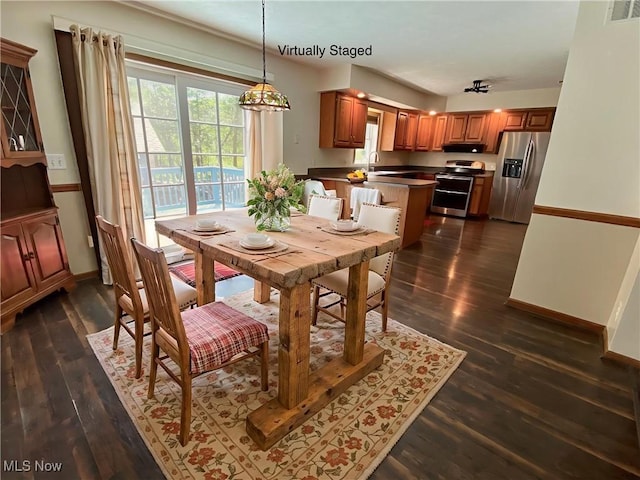 13781 Rustic Dr, North Royalton, OH 44133 - dining area featuring dark wood-style floors and healthy amount of natural light