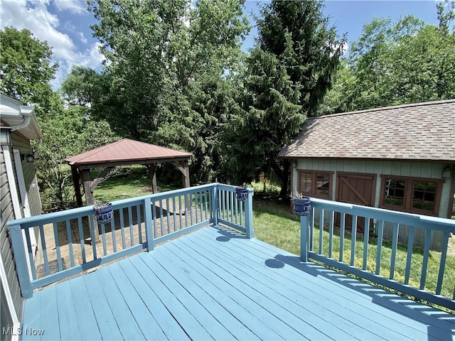 13781 Rustic Dr, North Royalton, OH 44133 - wooden deck featuring a gazebo, a lawn, and an outdoor structure