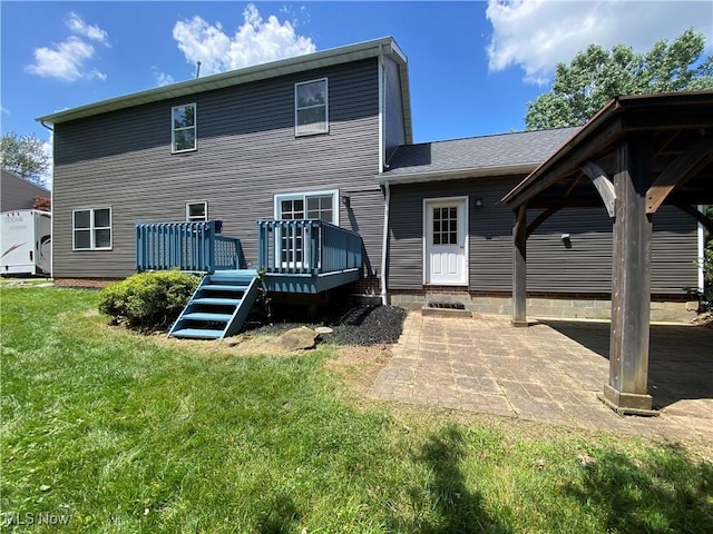 13781 Rustic Dr, North Royalton, OH 44133 - back of house featuring a deck, a yard, and a patio