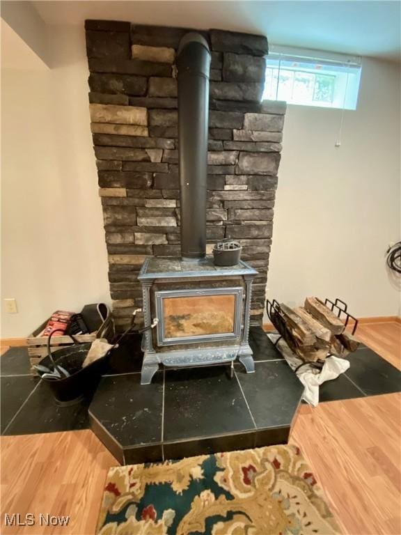 13781 Rustic Dr, North Royalton, OH 44133 - detailed view of a wood stove and wood finished floors
