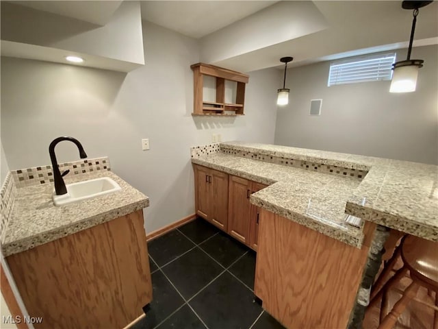 13781 Rustic Dr, North Royalton, OH 44133 - indoor bar with dark tile patterned floors, pendant lighting, and backsplash