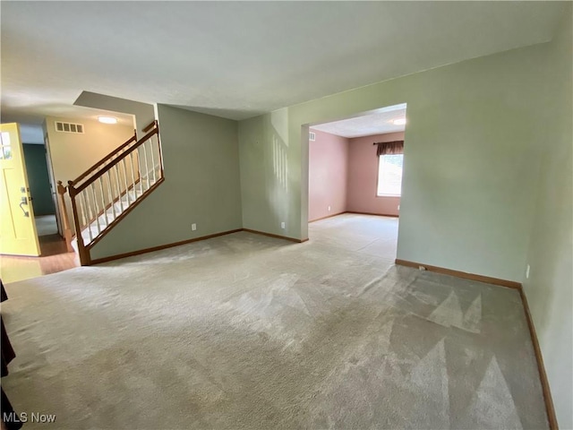 13781 Rustic Dr, North Royalton, OH 44133 - unfurnished living room featuring stairway and carpet floors