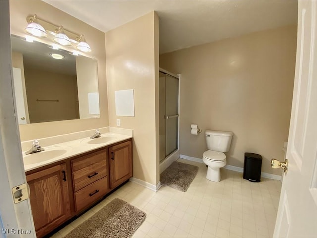 13781 Rustic Dr, North Royalton, OH 44133 - bathroom with a stall shower, double vanity, and tile patterned floors
