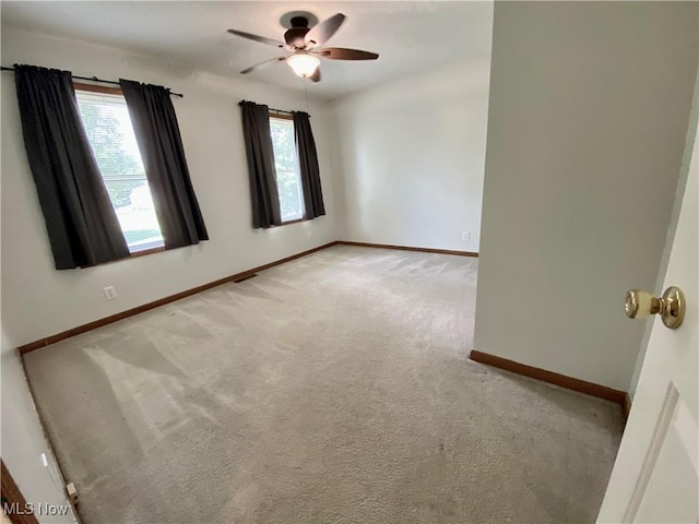 13781 Rustic Dr, North Royalton, OH 44133 - unfurnished room featuring plenty of natural light, light carpet, and a ceiling fan