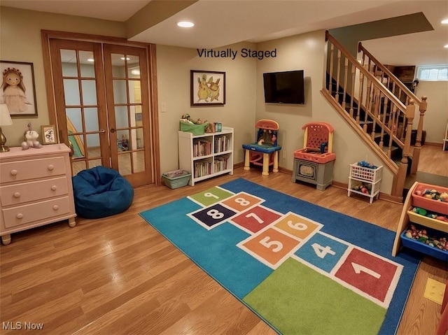 13781 Rustic Dr, North Royalton, OH 44133 - recreation room featuring french doors, wood finished floors, and recessed lighting