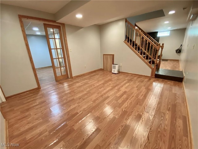 13781 Rustic Dr, North Royalton, OH 44133 - unfurnished living room featuring wood finished floors, stairs, and recessed lighting