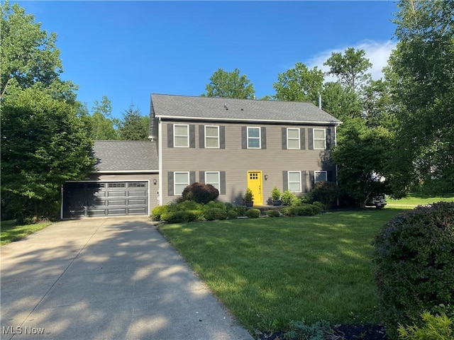13781 Rustic Dr, North Royalton, OH 44133 - colonial inspired home with an attached garage, driveway, and a front lawn