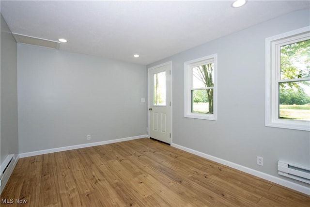 290 State Route 60, Greenwich, OH 44837 - empty room featuring a baseboard radiator, light wood-style flooring, and recessed lighting