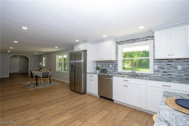290 State Route 60, Greenwich, OH 44837 - kitchen with stainless steel appliances, decorative backsplash, white cabinetry, light stone countertops, and recessed lighting