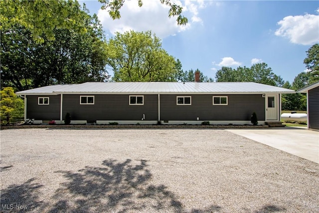 290 State Route 60, Greenwich, OH 44837 - back of property with a metal roof, entry steps, and uncovered parking