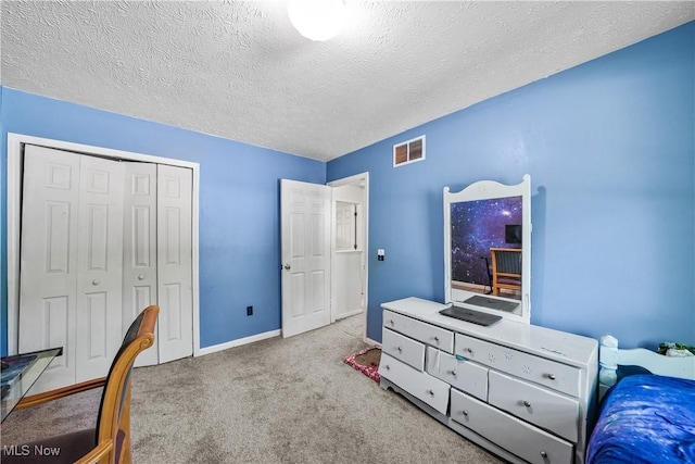 9009 Oak Ct, Windham, OH 44288 - carpeted bedroom with a textured ceiling and a closet