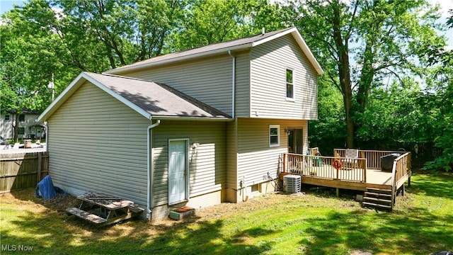 9009 Oak Ct, Windham, OH 44288 - view of property exterior featuring a deck, view of scattered trees, and roof with shingles