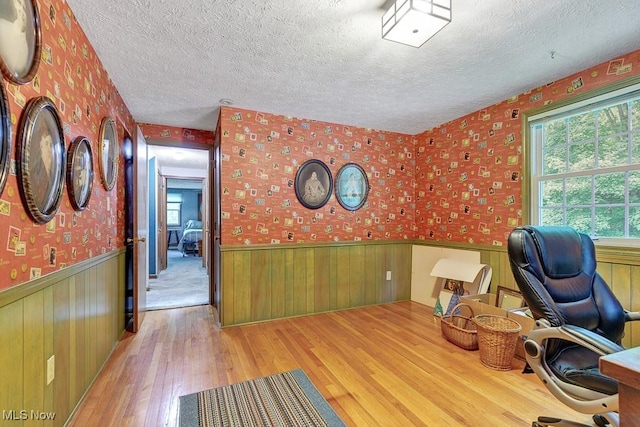 9502 Winchester Vly, Chesterland, OH 44026 - office area featuring a textured ceiling, wainscoting, wood finished floors, wallpapered walls, and wood walls