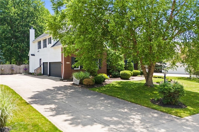 3519 Hawthorne Trl, Broadview Heights, OH 44147 - view of front of property with an attached garage, driveway, a chimney, and brick siding