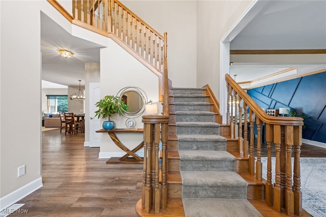 3519 Hawthorne Trl, Broadview Heights, OH 44147 - stairs with wood finished floors, a chandelier, and a high ceiling