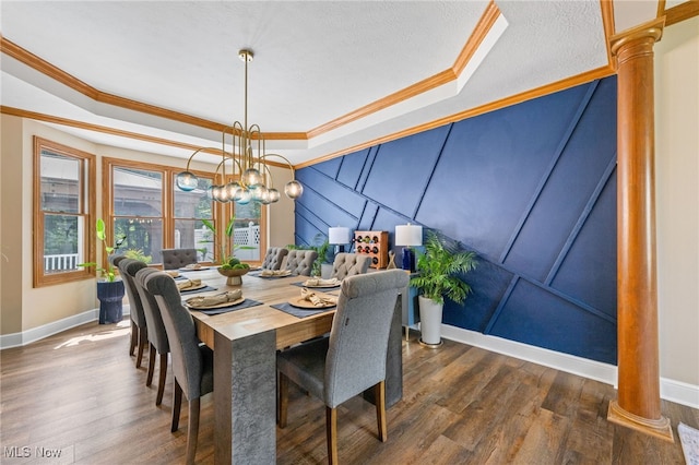3519 Hawthorne Trl, Broadview Heights, OH 44147 - dining space featuring a tray ceiling, crown molding, wood finished floors, and a chandelier