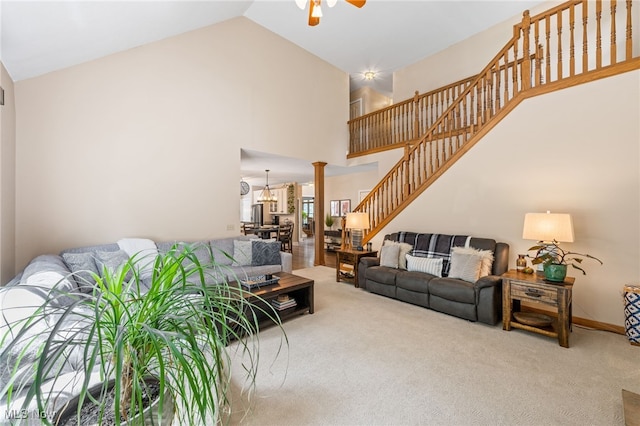 3519 Hawthorne Trl, Broadview Heights, OH 44147 - living room with high vaulted ceiling, ceiling fan, stairway, and carpet floors