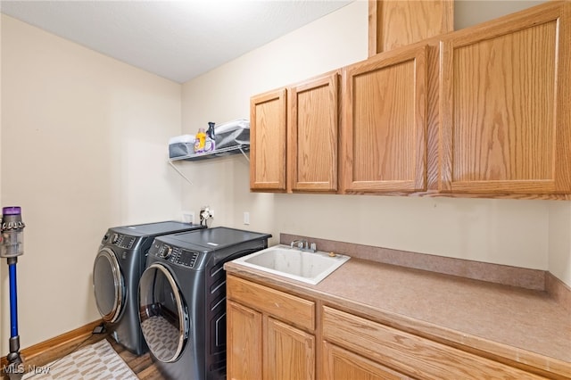 3519 Hawthorne Trl, Broadview Heights, OH 44147 - laundry area featuring cabinet space, washer and clothes dryer, and wood finished floors