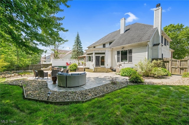 3519 Hawthorne Trl, Broadview Heights, OH 44147 - back of property with an outdoor living space, a chimney, a patio area, and a shingled roof