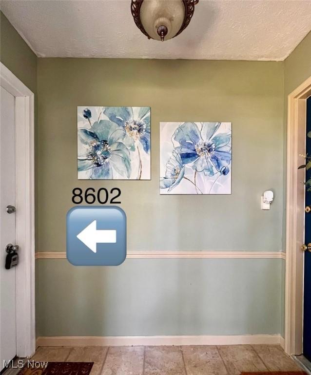 8602 Wedgewood Ave NW, North Canton, OH 44720 - detailed view of a textured ceiling and baseboards