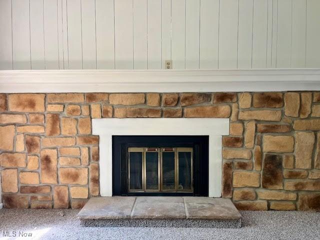 8602 Wedgewood Ave NW, North Canton, OH 44720 - detailed view of a glass covered fireplace and carpet