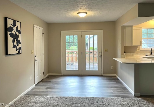 8602 Wedgewood Ave NW, North Canton, OH 44720 - entryway featuring a textured ceiling and wood finished floors
