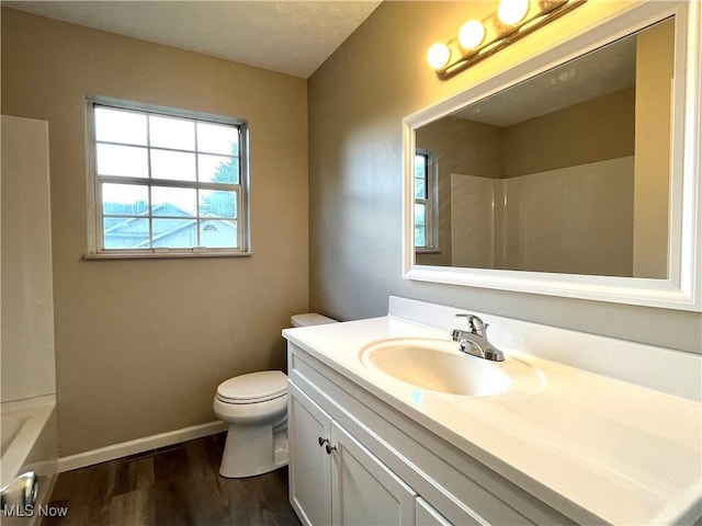 8602 Wedgewood Ave NW, North Canton, OH 44720 - full bath featuring wood finished floors, vanity, a shower, and a bath